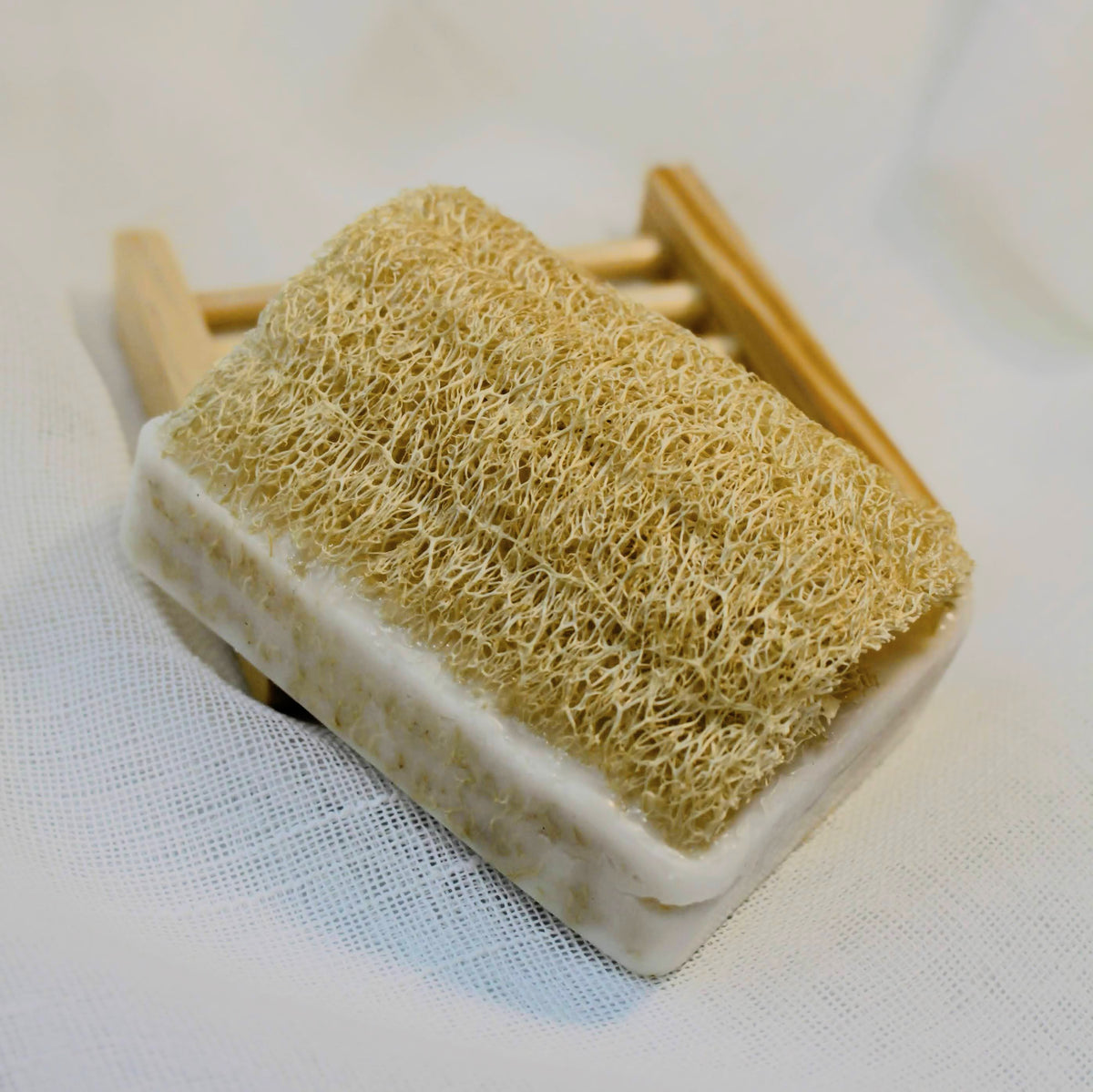 Sustainable and eco-friendly natural loofah (luffa) sponge bar soap made in California that can be used for women's selfcare