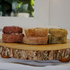 Sustainable and eco-friendly natural loofah (luffa) pet dental aid made in California on top of a wooden surface
