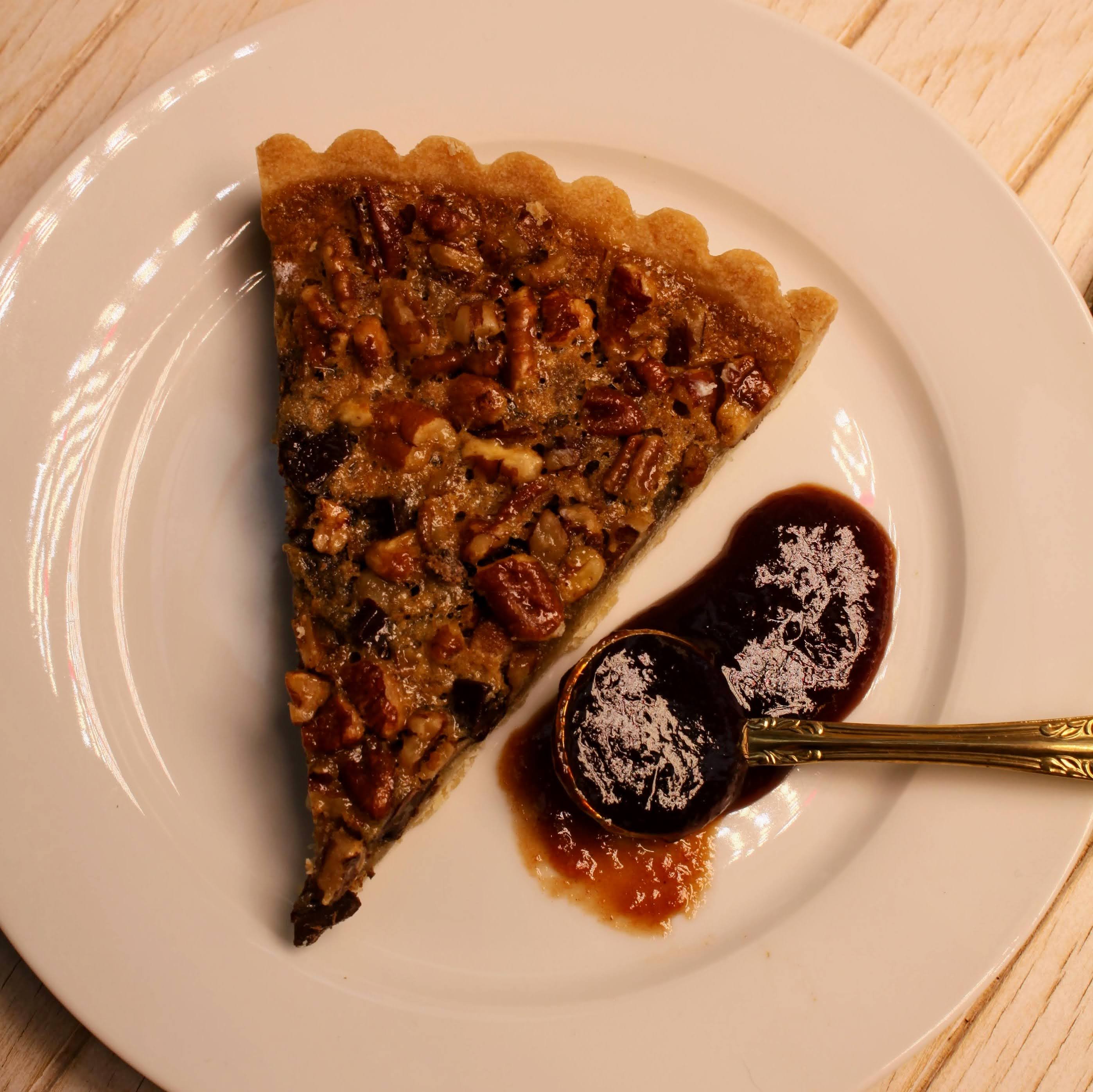 Slice of pecan pie with a spoonful of organic Rebel Thumb jam made in California 