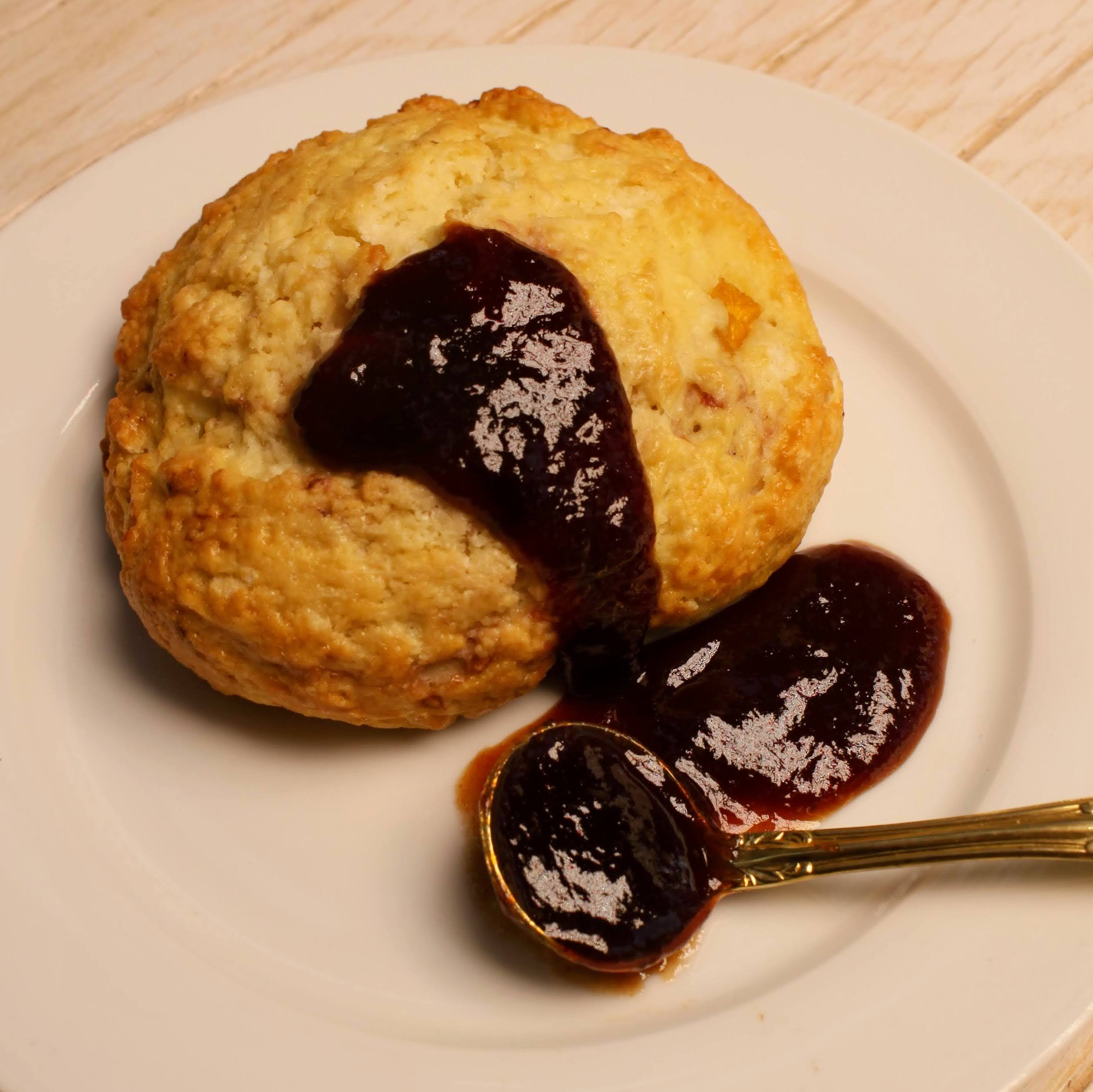 Scone with spoonful of Rebel Thumb organic jam made in California