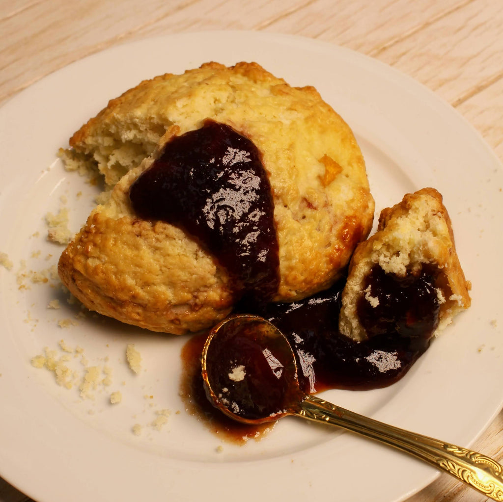 Scone with a spoonful of organic Rebel Thumb jam made in California